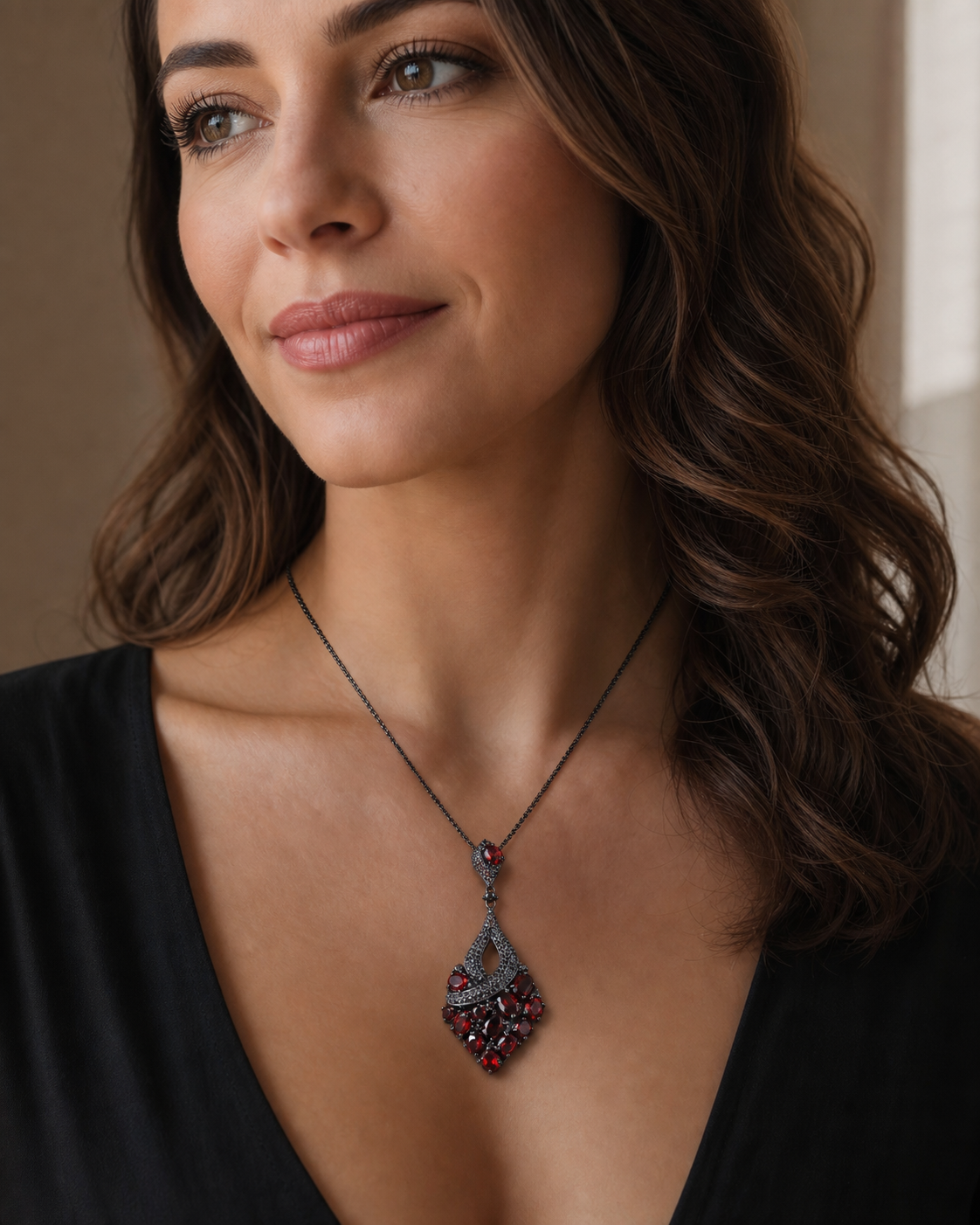 Theiaura Prism Grove Pendant Necklace in garnet worn by a woman
